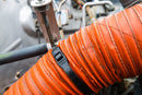 Cobra low profile black zip tie being used to secure a hose cleaner and safer than traditional ties